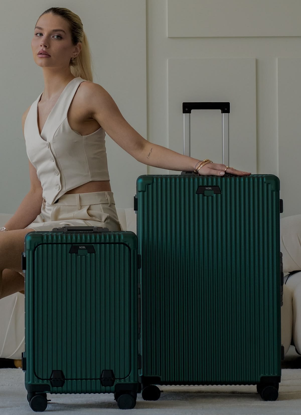 Travellers walking through an airport with premium luggage